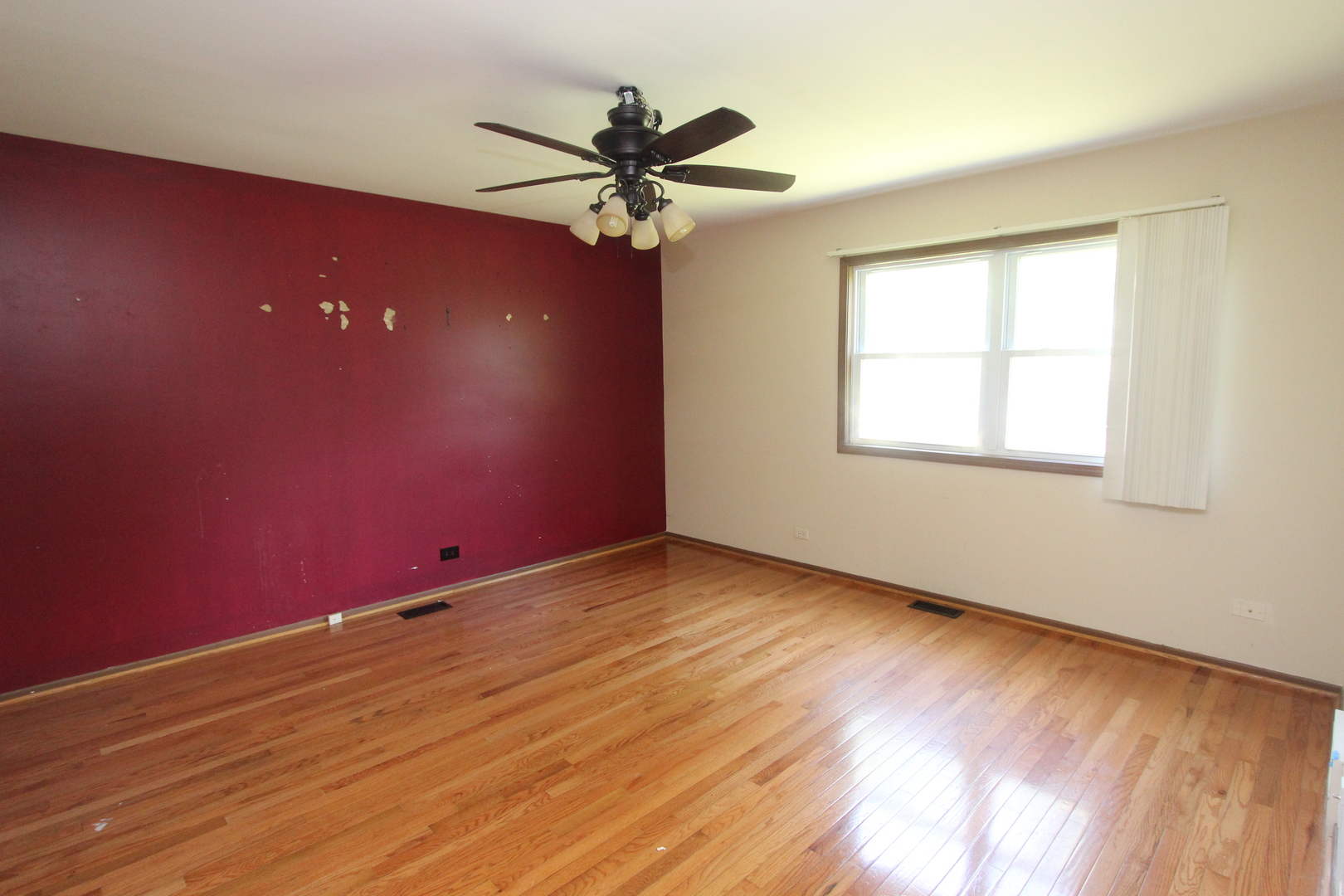503 Plum Street Lake In The Hills, IL 60156 - Photo 8 of 20 a view of empty room with wooden floor and fan