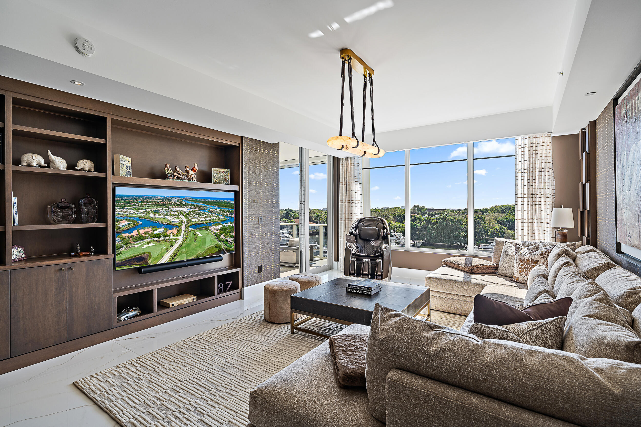 2720 Donald Ross Road, Unit 505 Palm Beach Gardens, FL 33410 - Photo 15 of 43 a living room with furniture and a flat screen tv
