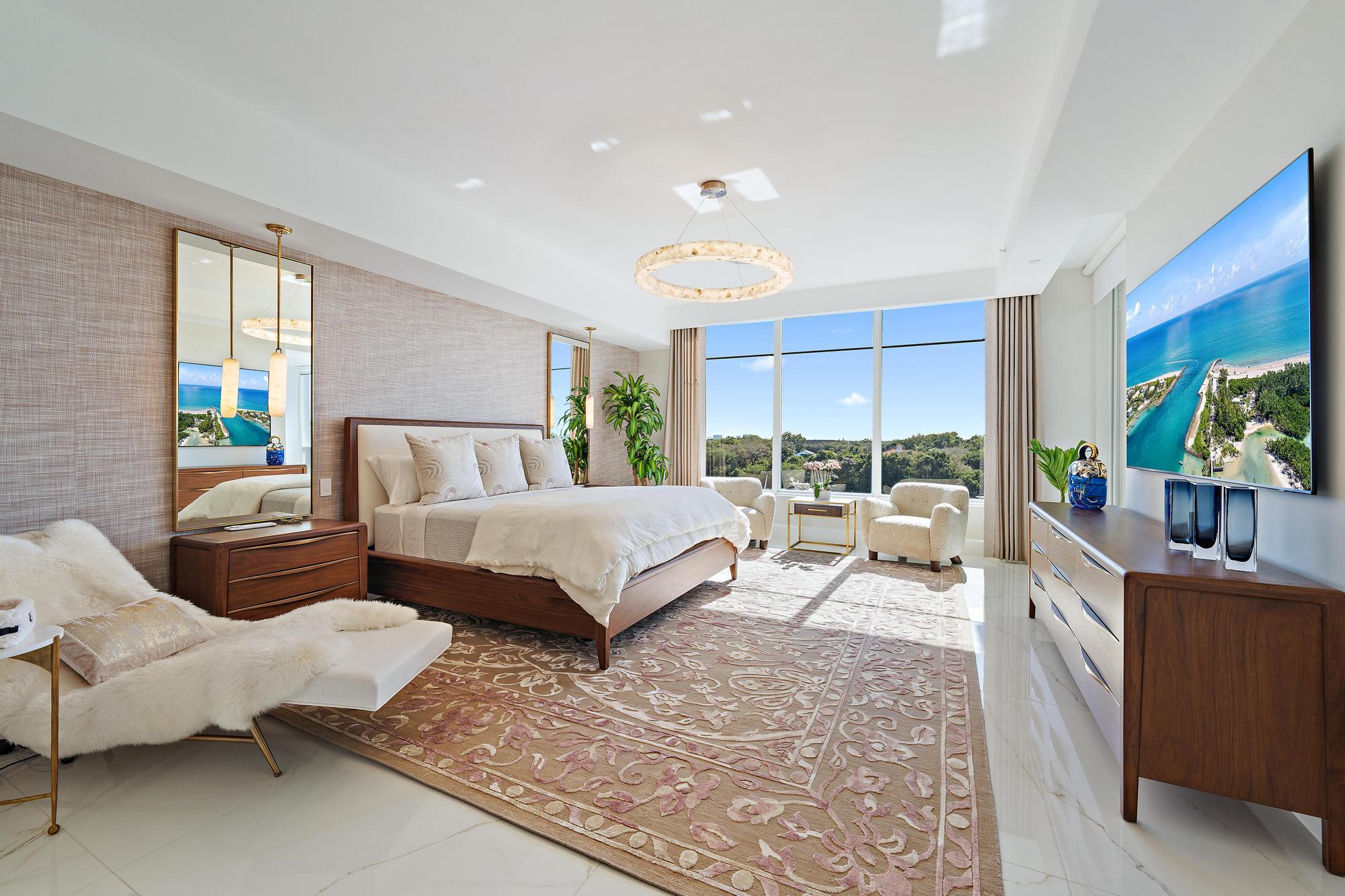 2720 Donald Ross Road, Unit 505 Palm Beach Gardens, FL 33410 - Photo 16 of 43 a spacious bedroom with a bed and large windows