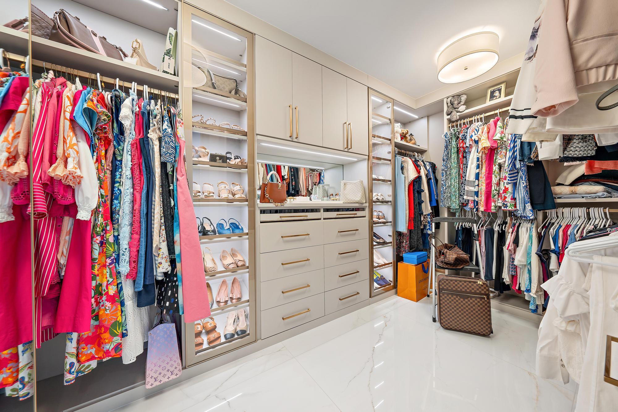 2720 Donald Ross Road, Unit 505 Palm Beach Gardens, FL 33410 - Photo 22 of 43 a view of walk in closet with clothes and shoes