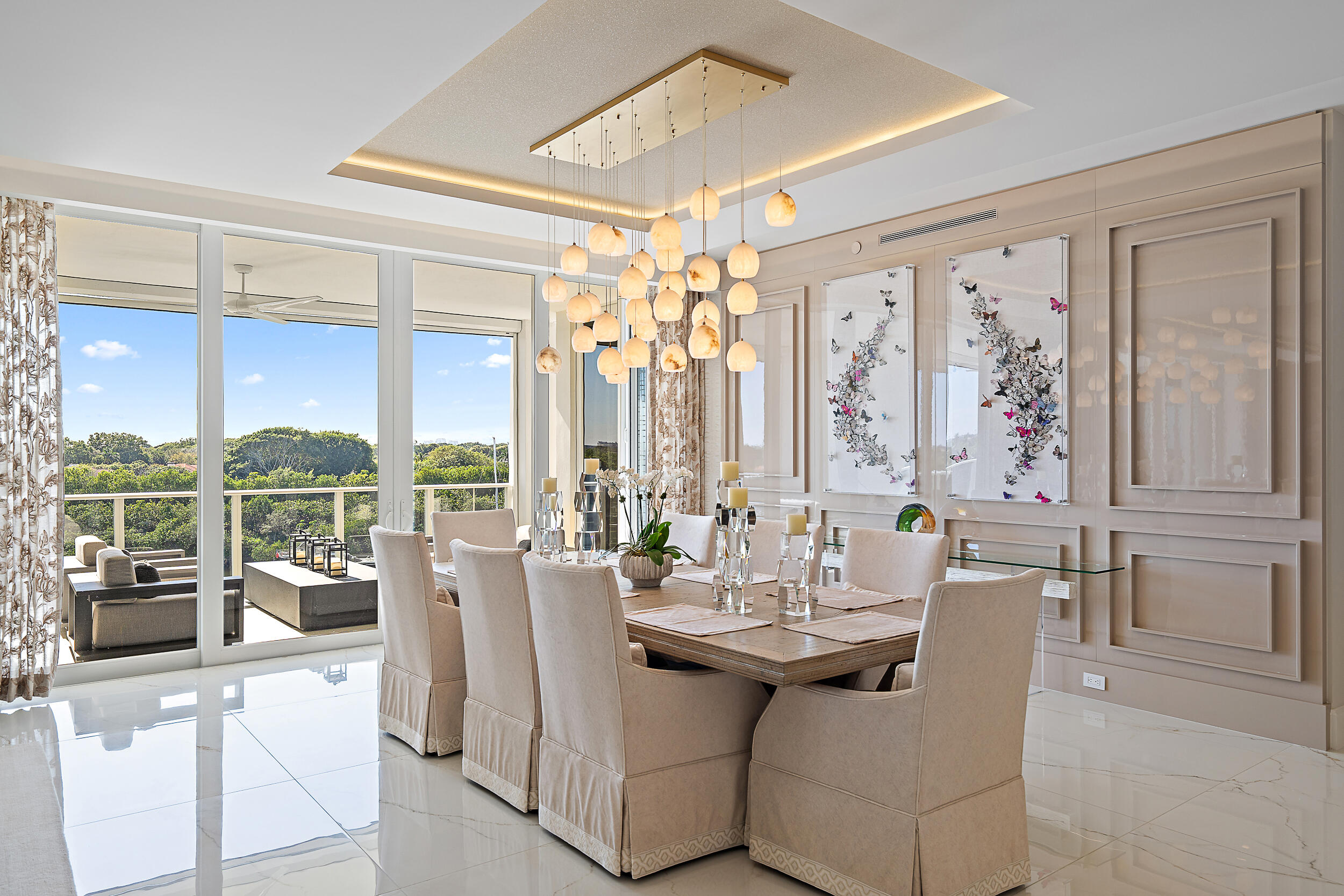 2720 Donald Ross Road, Unit 505 Palm Beach Gardens, FL 33410 - Photo 7 of 43 a view of a dining room with furniture large windows and wooden floor