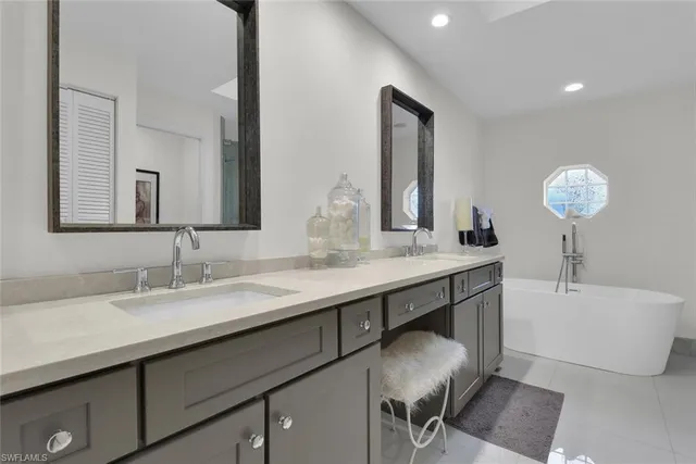 a bathroom with a double vanity sink and a mirror
