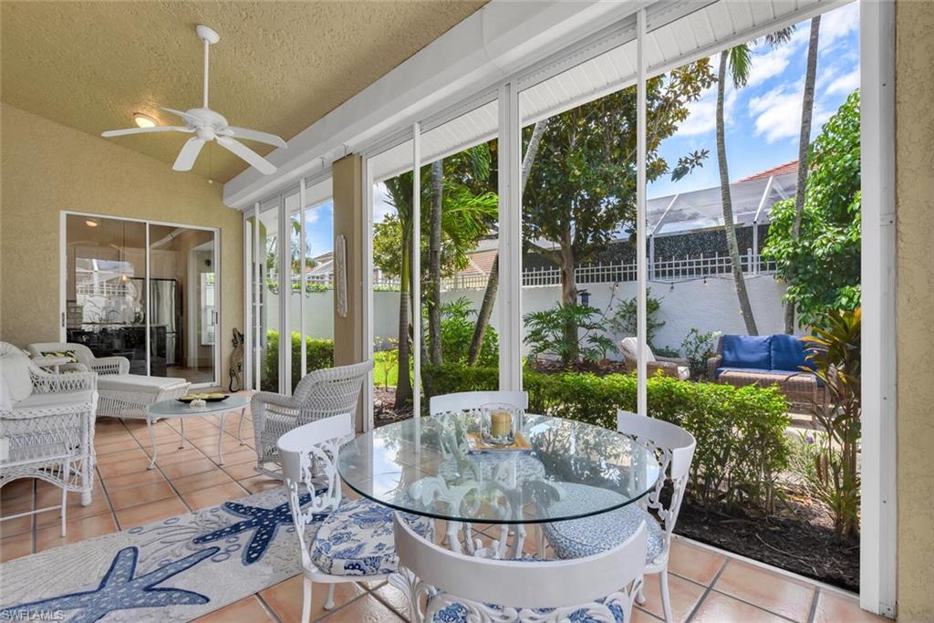 2124 Paget Circle, Unit 1 Naples, FL 34112 - Photo 17 of 31 a living room with furniture and a potted plant