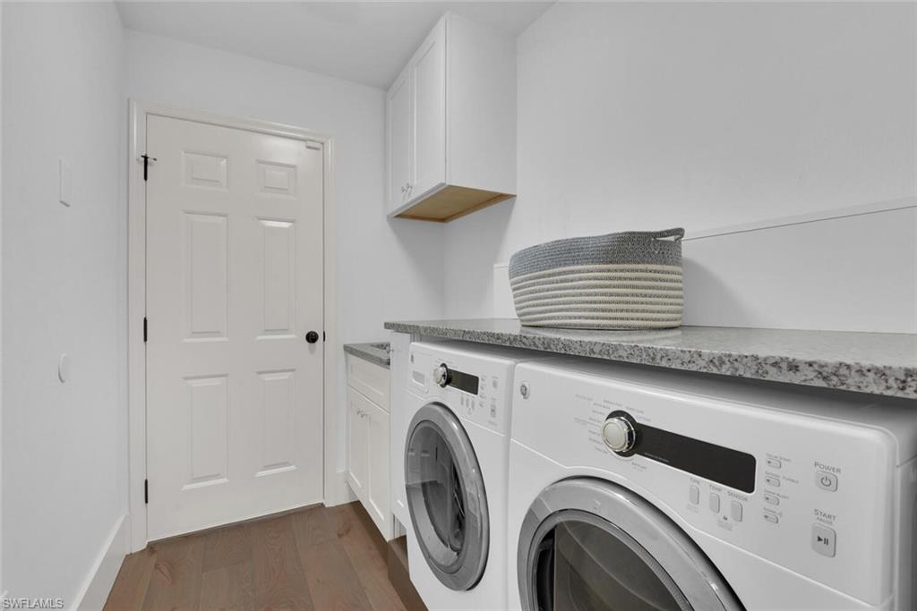 2124 Paget Circle, Unit 1 Naples, FL 34112 - Photo 19 of 31 a utility room with dryer and washer