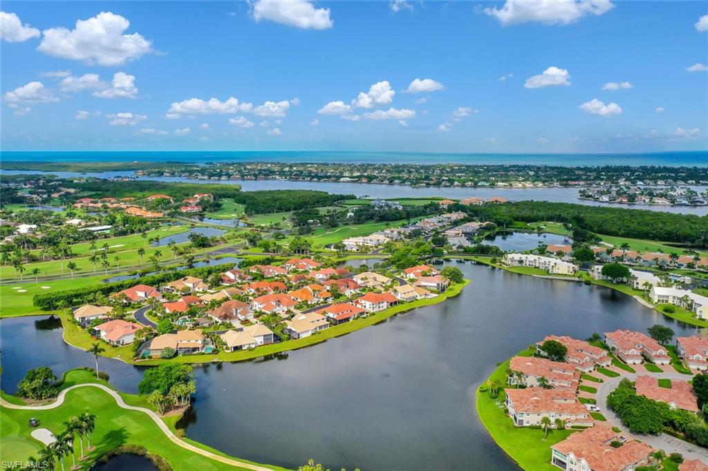 2124 Paget Circle, Unit 1 Naples, FL 34112 - Photo 25 of 31 a view of a lake from a balcony