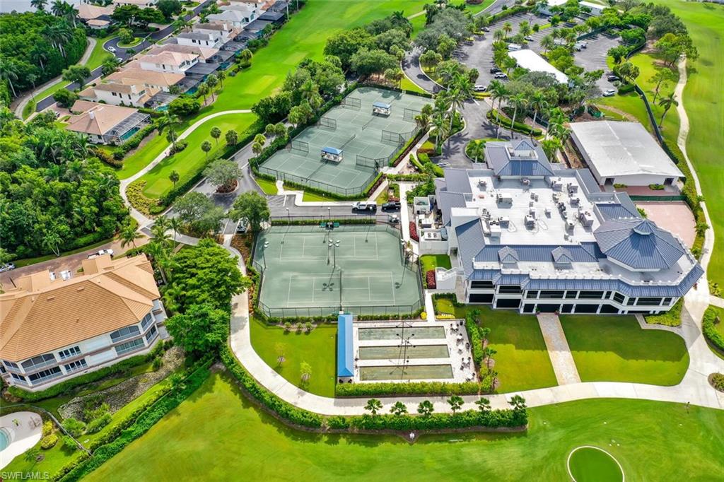 2124 Paget Circle, Unit 1 Naples, FL 34112 - Photo 30 of 31 an aerial view of a house with a swimming pool outdoor seating and yard