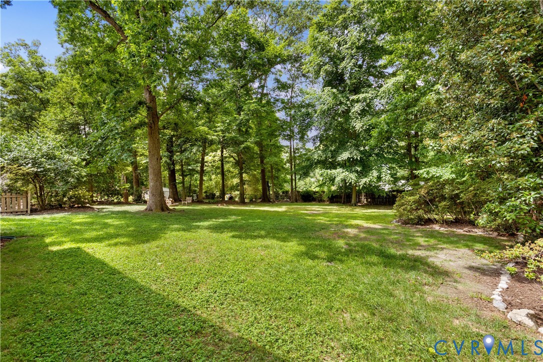 3136 Old Quarry Road Richmond, VA 23225 - Photo 24 of 39 Expansive backyard featuring a large grassy area,