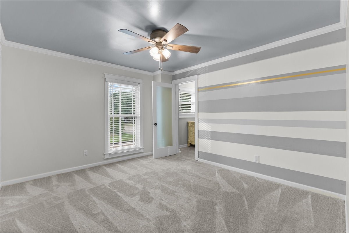 1572 Silverpines Road, Unit 572 Houston, TX 77062 - Photo 15 of 37 The primary bedroom upstairs has been tastefully decorated with the wall treatment and newer carpet. It also has an ensuite and walk-in closet.