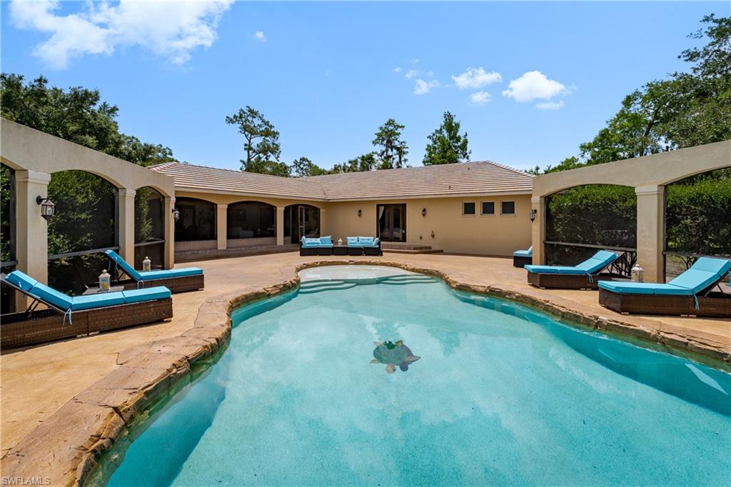 1781 21st Street Southwest Naples, FL 34117 - Photo 14 of 39 a view of a house with swimming pool and porch