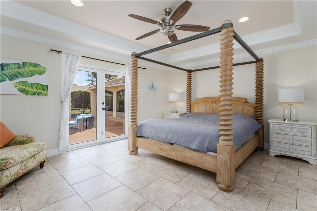 1781 21st Street Southwest Naples, FL 34117 - Photo 16 of 39 a bedroom with a bed and a walk in closet