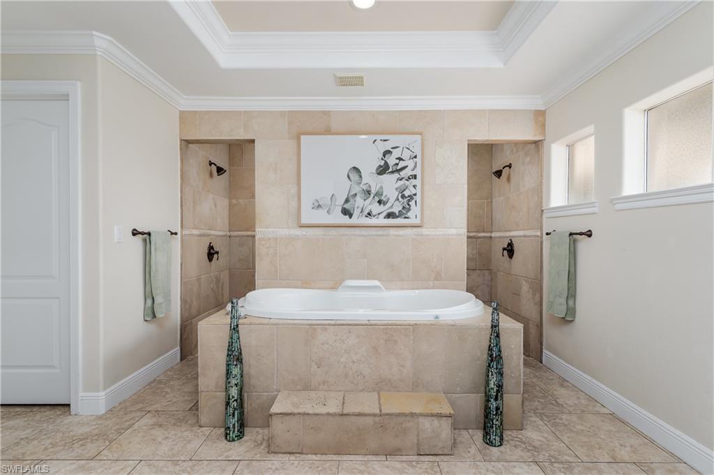 1781 21st Street Southwest Naples, FL 34117 - Photo 18 of 39 a large white tub sitting in a room