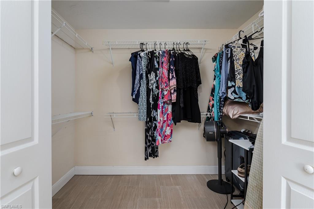 1781 21st Street Southwest Naples, FL 34117 - Photo 21 of 39 a view of walk in closet with clothes