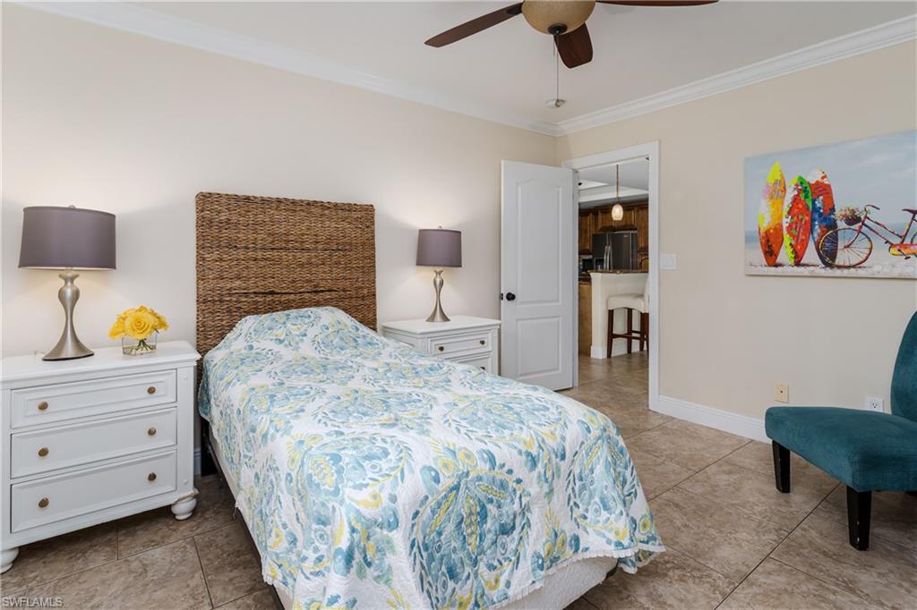 1781 21st Street Southwest Naples, FL 34117 - Photo 24 of 39 a bedroom with a bed and a couch