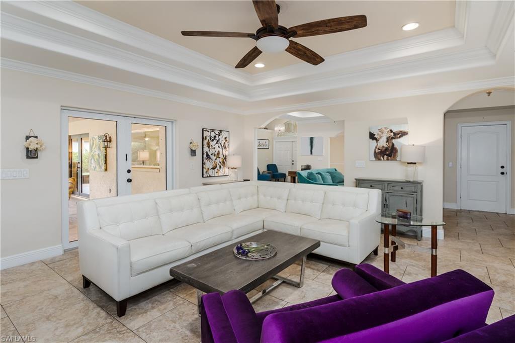 1781 21st Street Southwest Naples, FL 34117 - Photo 8 of 39 a living room with furniture and a wooden floor