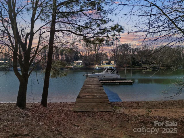 a view of a lake with boats and trees