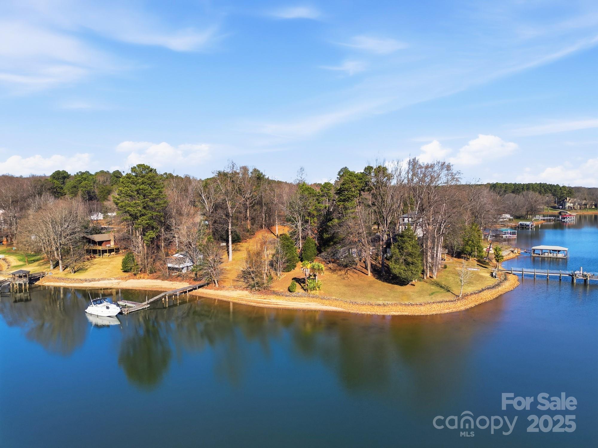 168 Willow Point Road Troutman, NC 28166 - Photo 13 of 16 a view of a lake with a mountain
