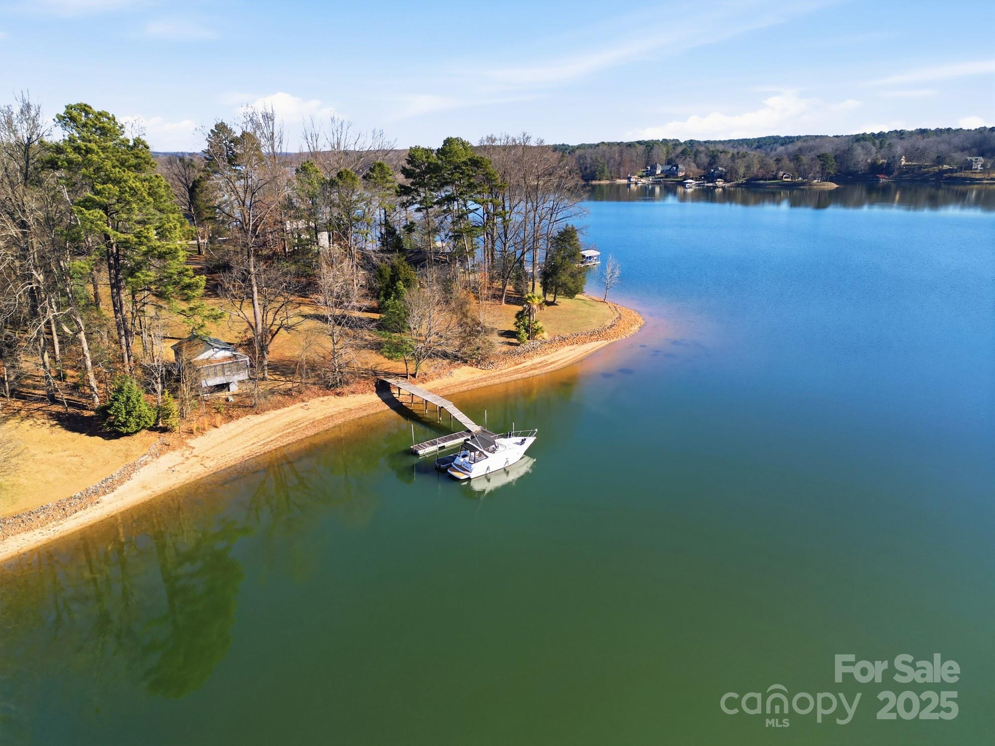 168 Willow Point Road Troutman, NC 28166 - Photo 8 of 16 a view of a lake with outdoor space