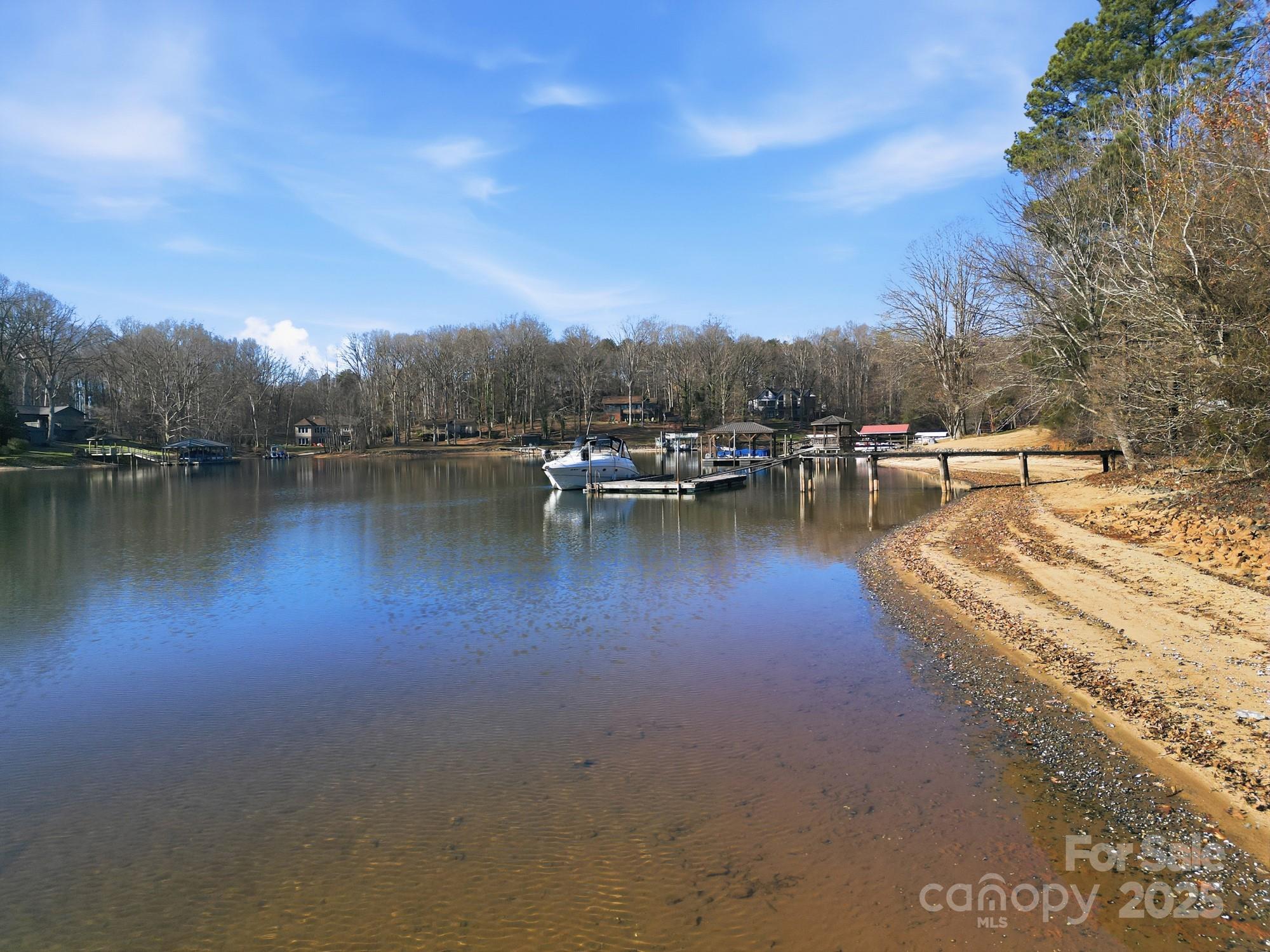 168 Willow Point Road Troutman, NC 28166 - Photo 9 of 16 a view of a lake with outdoor space