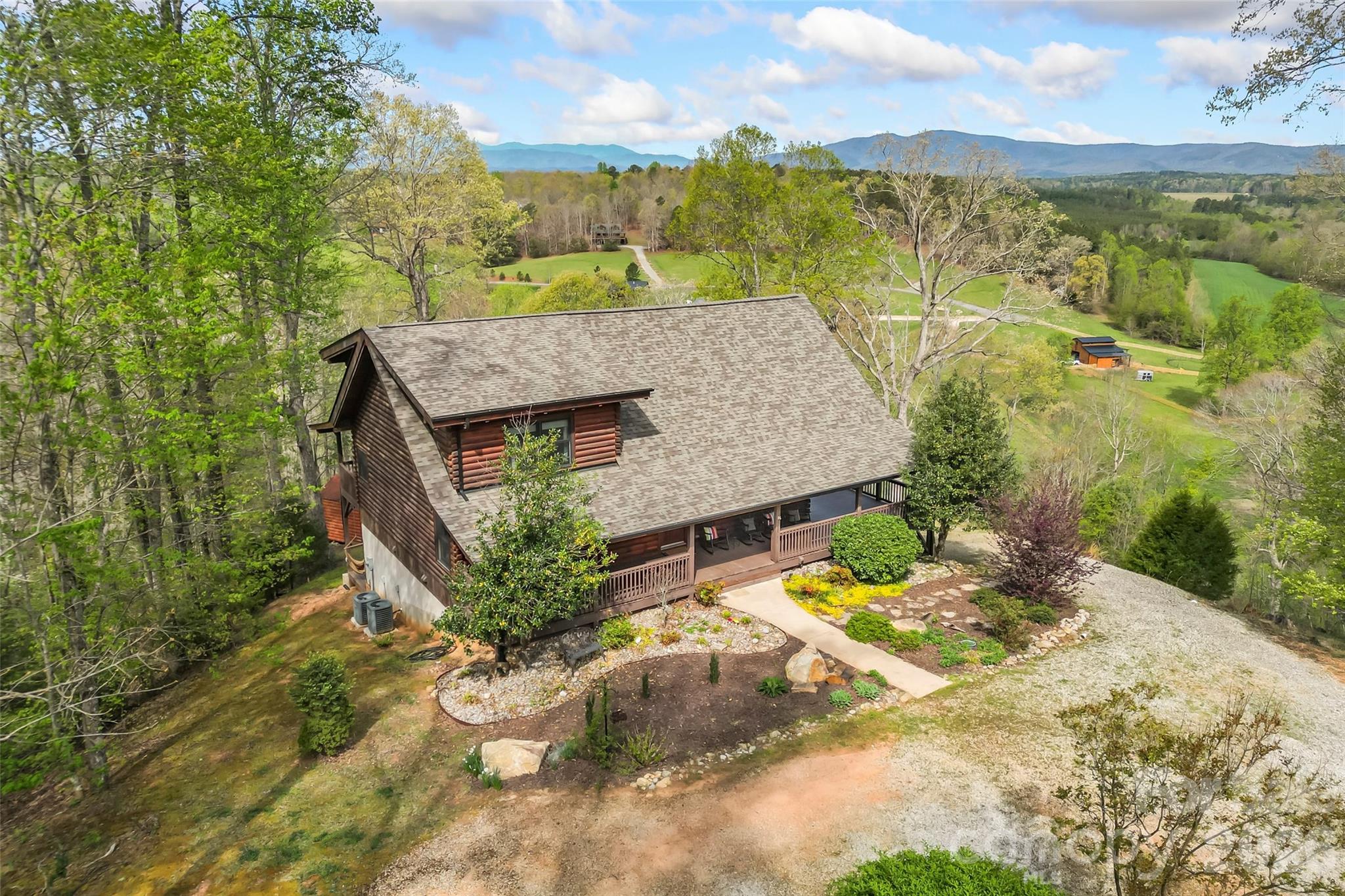 295 Outback Trail, Unit 29 Nebo, NC 28761 - Photo 1 of 46 a view of a swimming pool with a patio