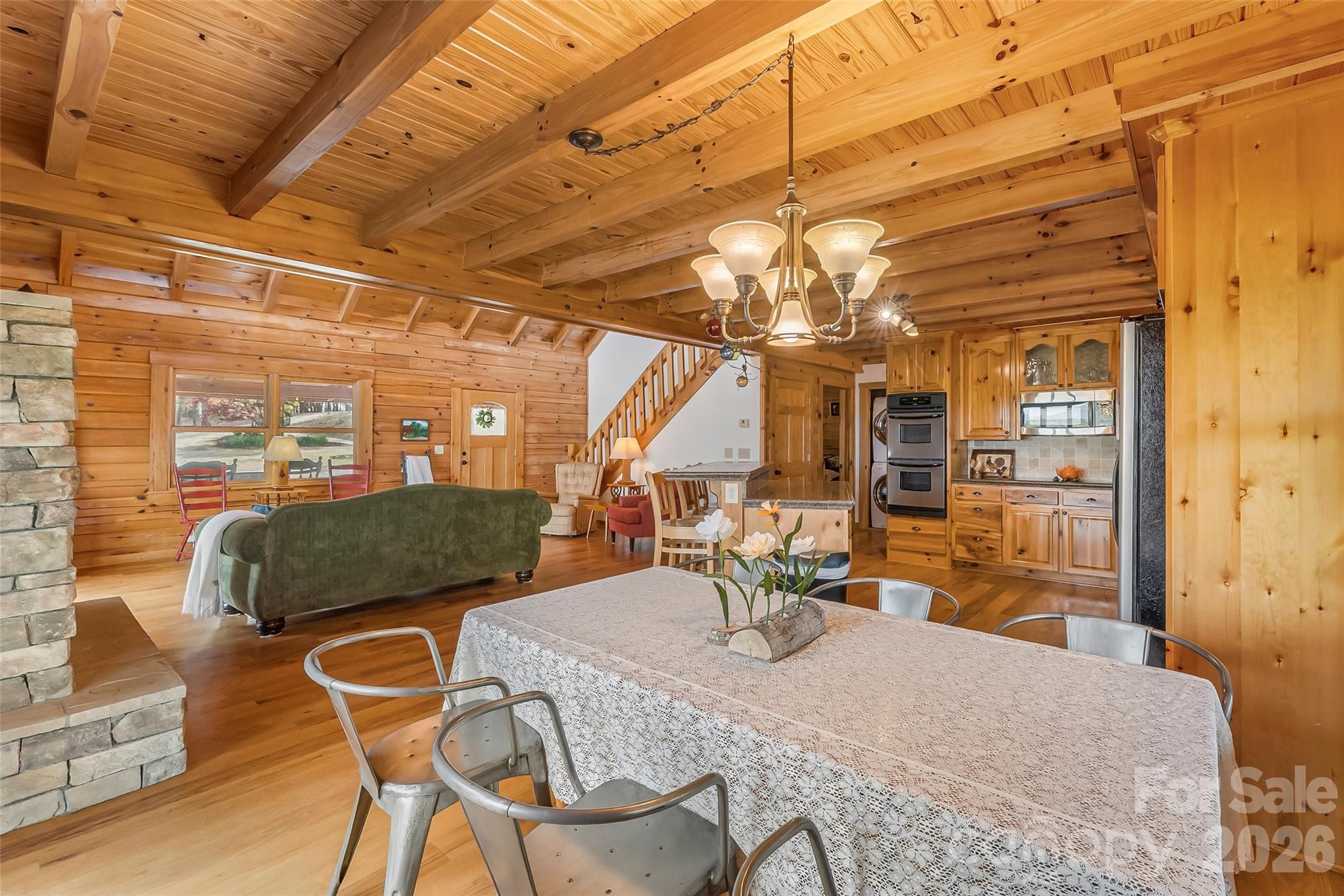 295 Outback Trail, Unit 29 Nebo, NC 28761 - Photo 14 of 46 a dining room with furniture and a chandelier