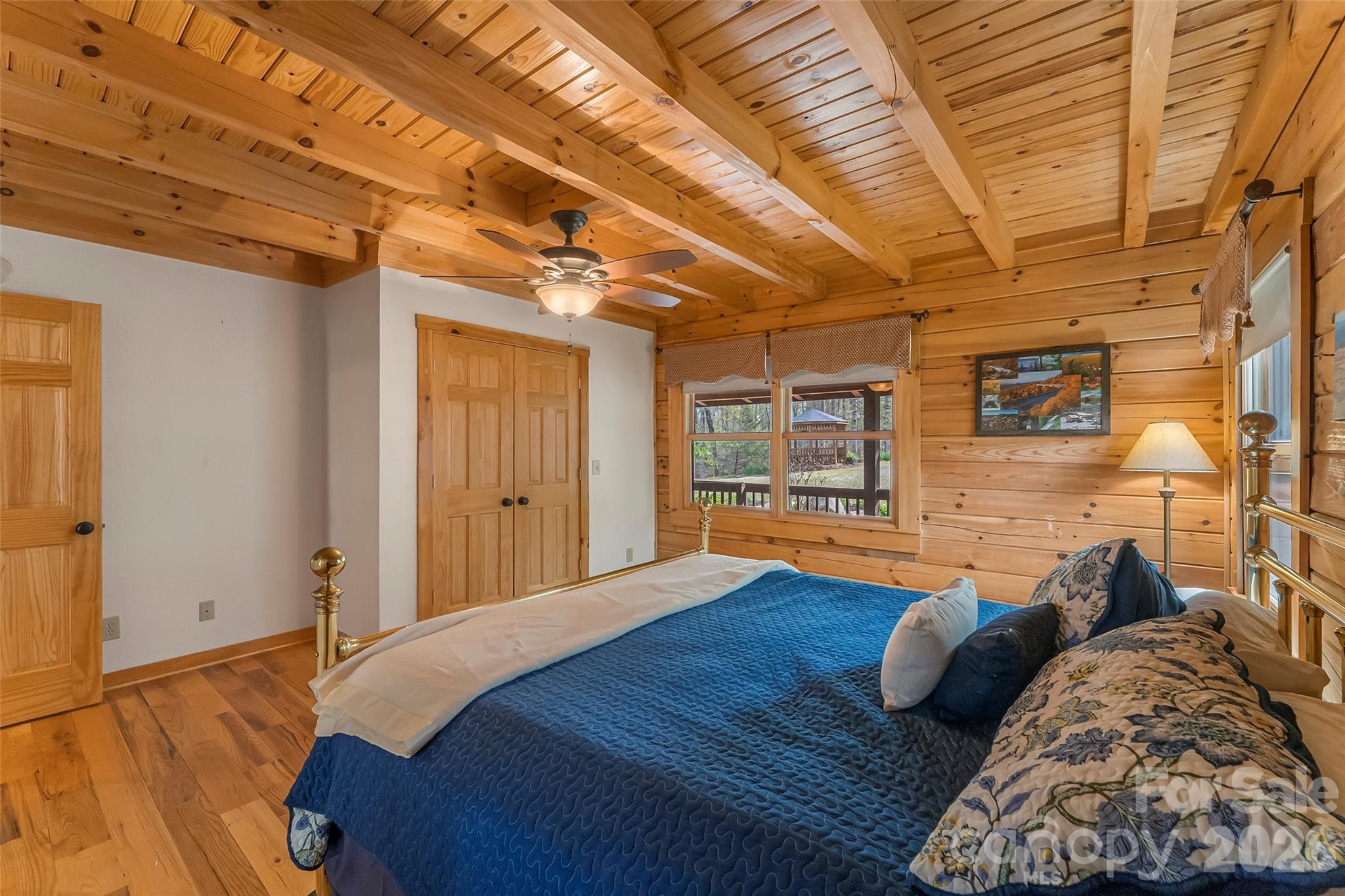 295 Outback Trail, Unit 29 Nebo, NC 28761 - Photo 20 of 46 a bed sitting in a spacious bedroom next to a window