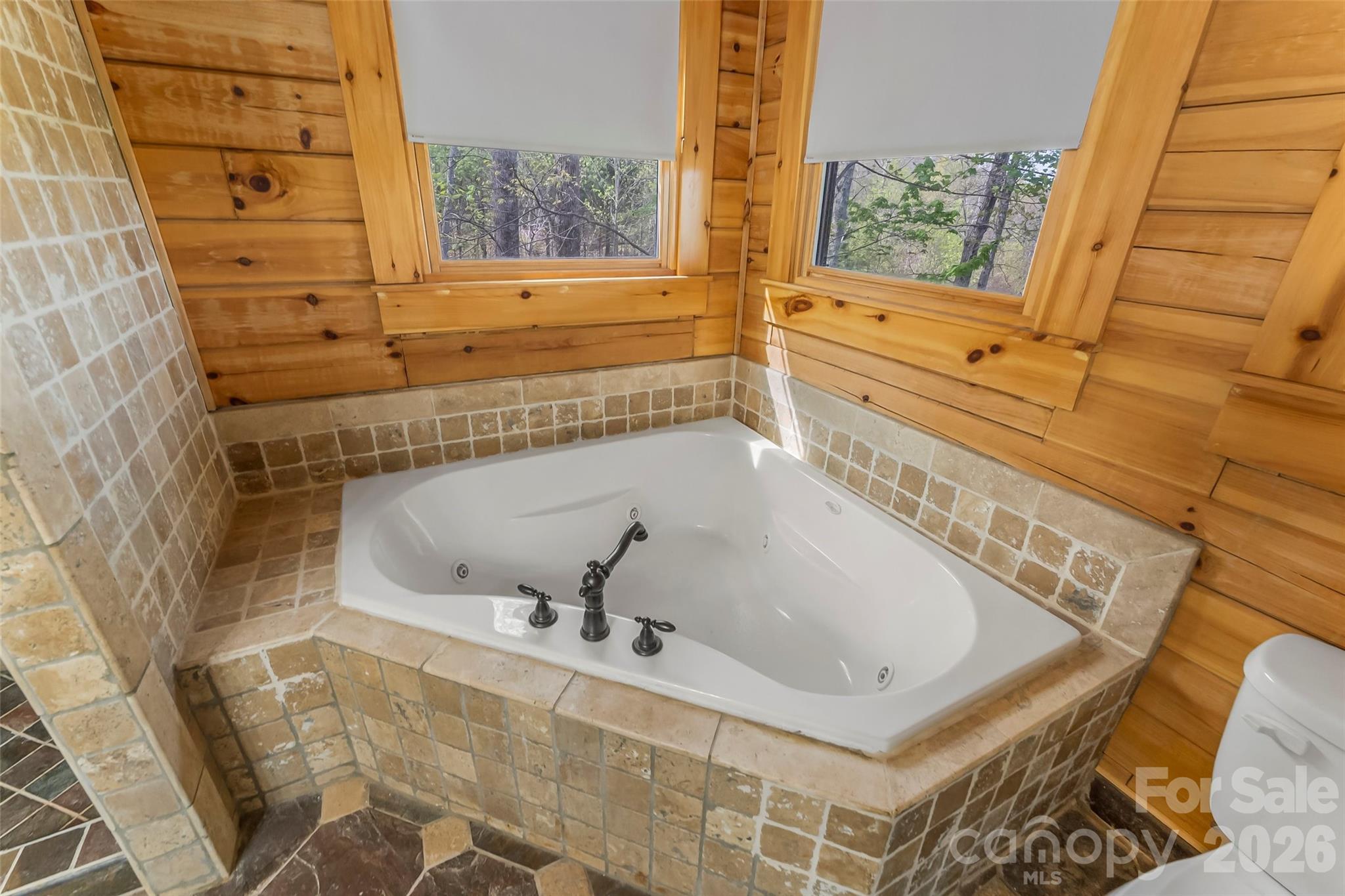 295 Outback Trail, Unit 29 Nebo, NC 28761 - Photo 22 of 46 a bathroom with a bathtub and window