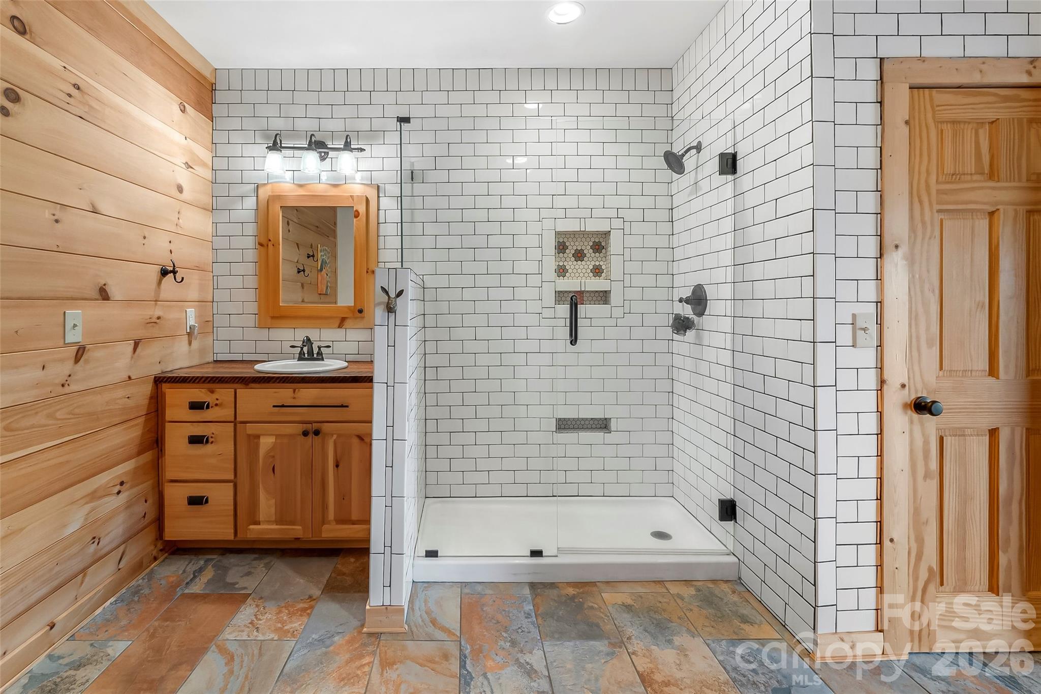 295 Outback Trail, Unit 29 Nebo, NC 28761 - Photo 32 of 46 a bathroom with a bathtub and a shower