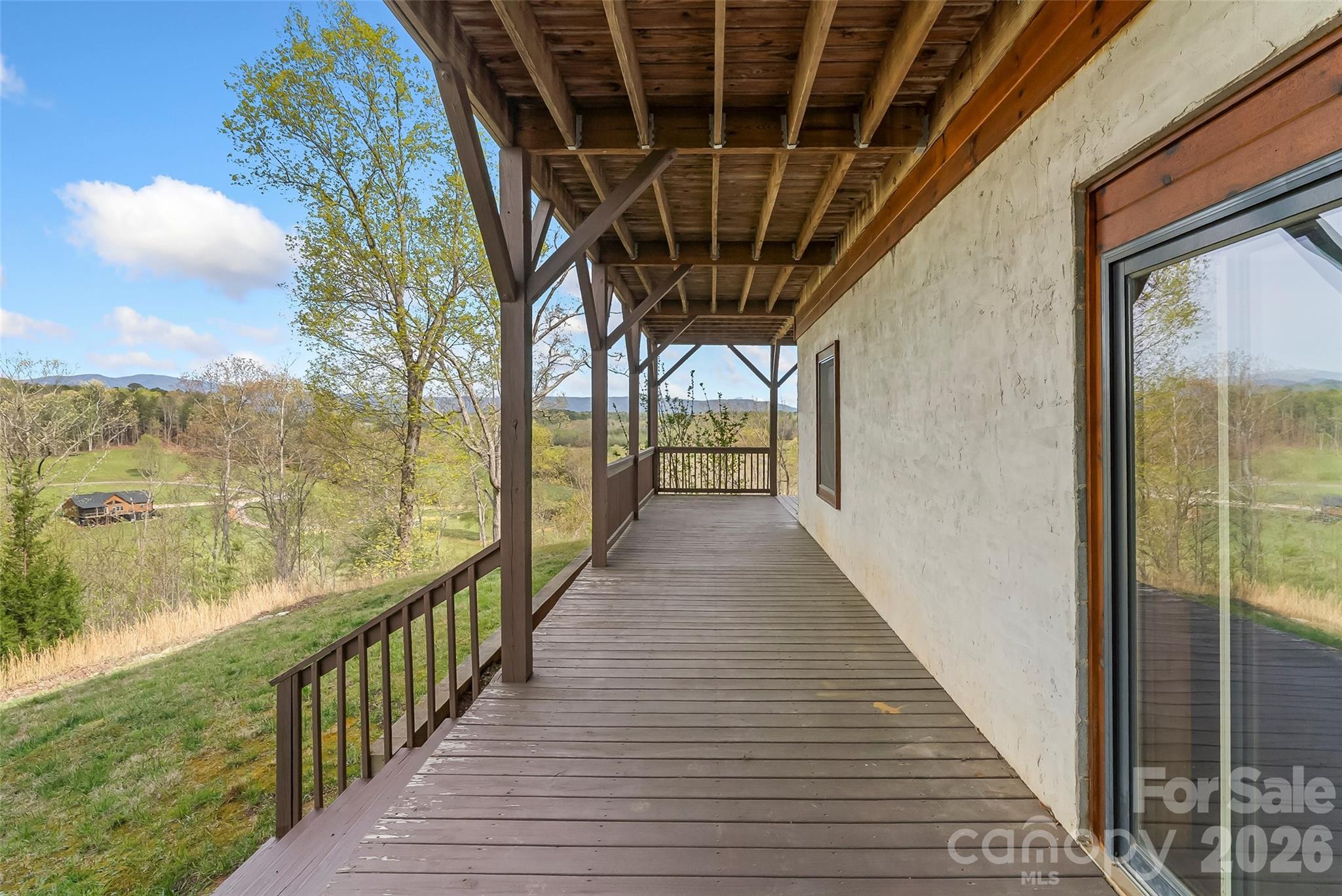 295 Outback Trail, Unit 29 Nebo, NC 28761 - Photo 38 of 46 a view of a balcony with wooden floor