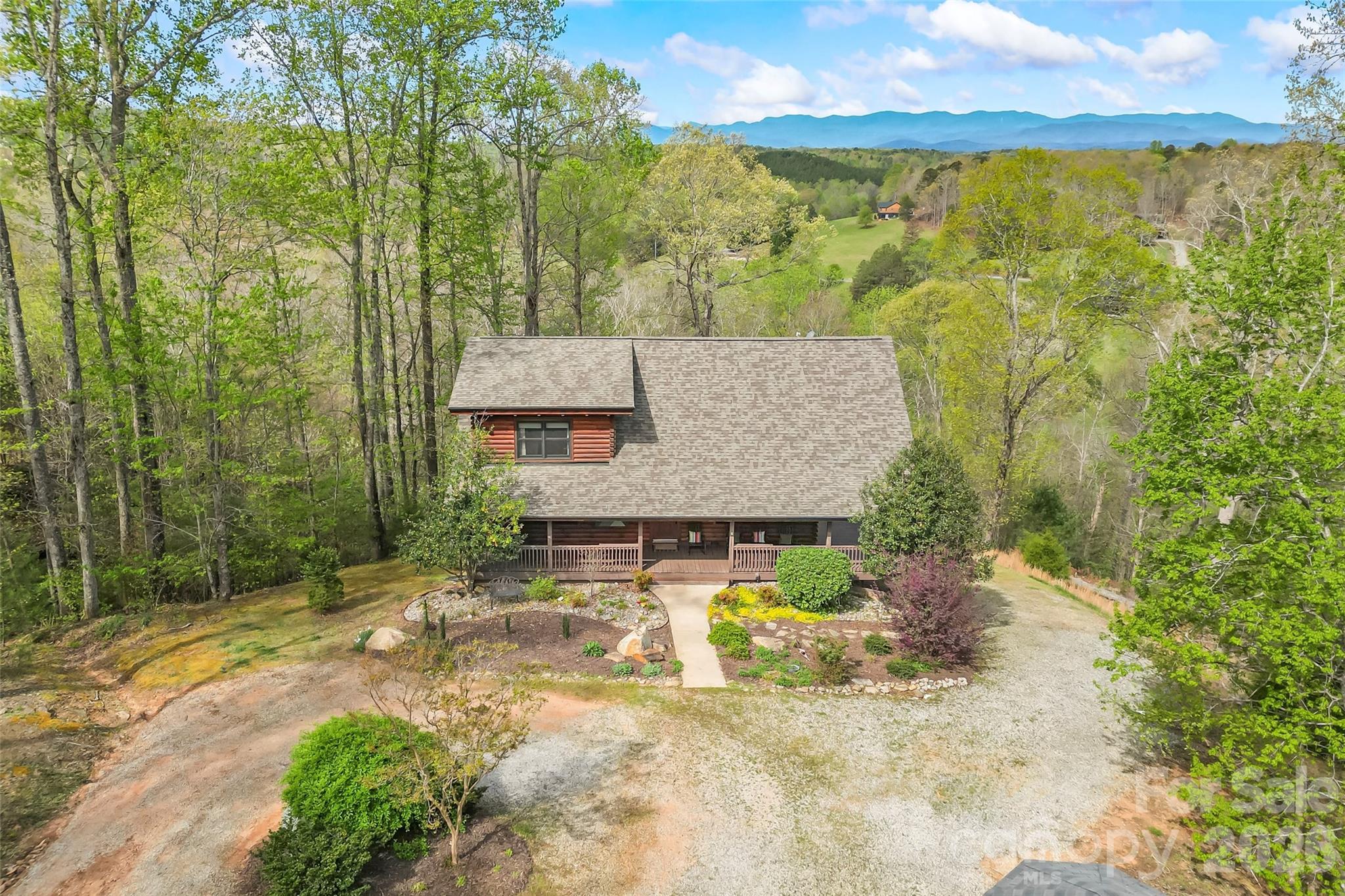295 Outback Trail, Unit 29 Nebo, NC 28761 - Photo 40 of 46 a view of a house with a yard and sitting area