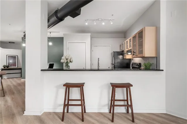 a view of room with window and wooden floor