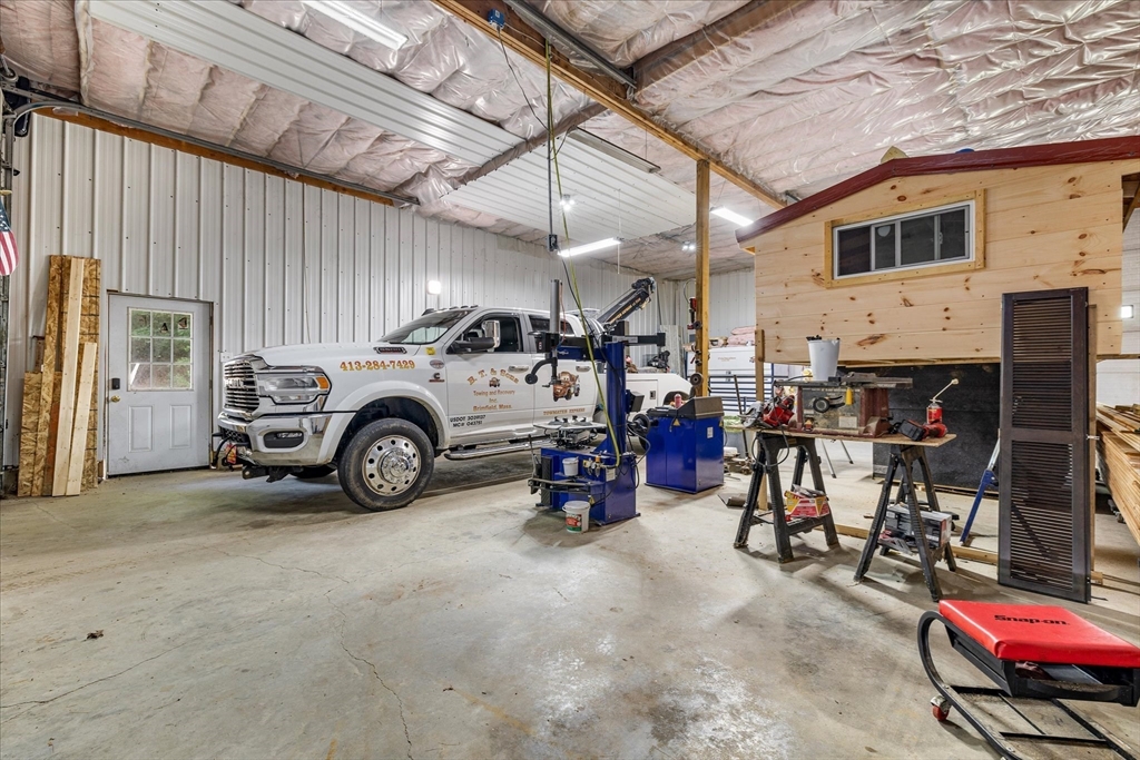 8 Oakwood Road Brimfield, MA 01010 - Photo 24 of 35 a view of a garage with furniture