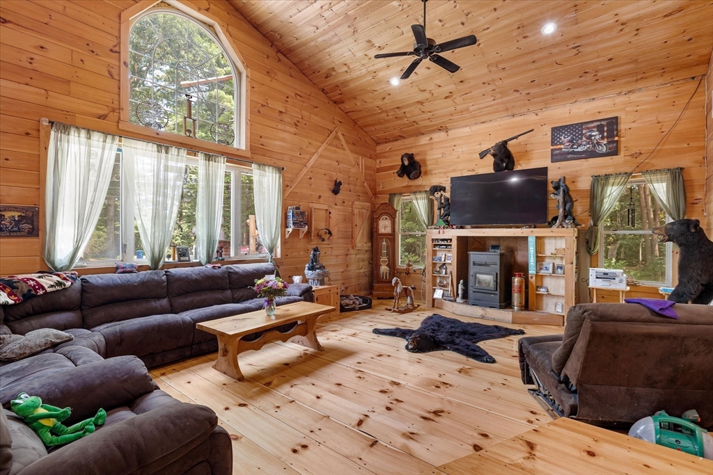 8 Oakwood Road Brimfield, MA 01010 - Photo 8 of 35 a living room with furniture fireplace and a flat screen tv