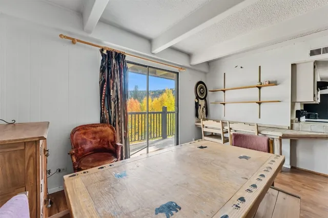 a bed room with a bed and a chair