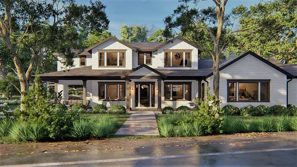 a front view of a house with a garden