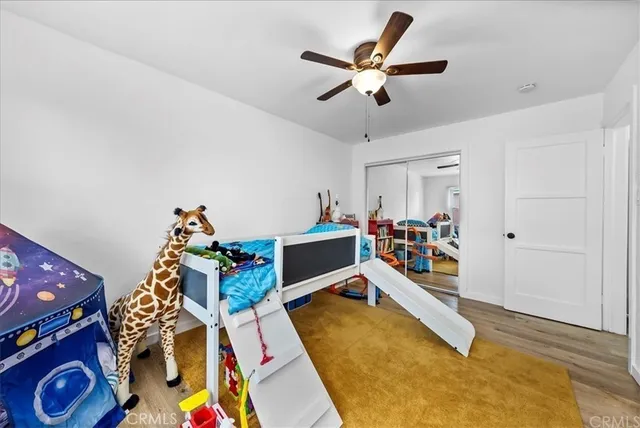 a bed room with a bed and a chandelier