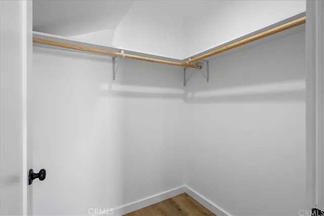 a view of a room with shelf on the wall