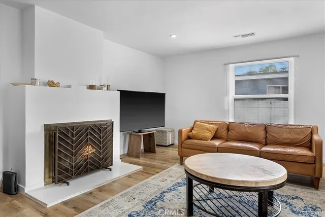 a living room with furniture a rug and a couch