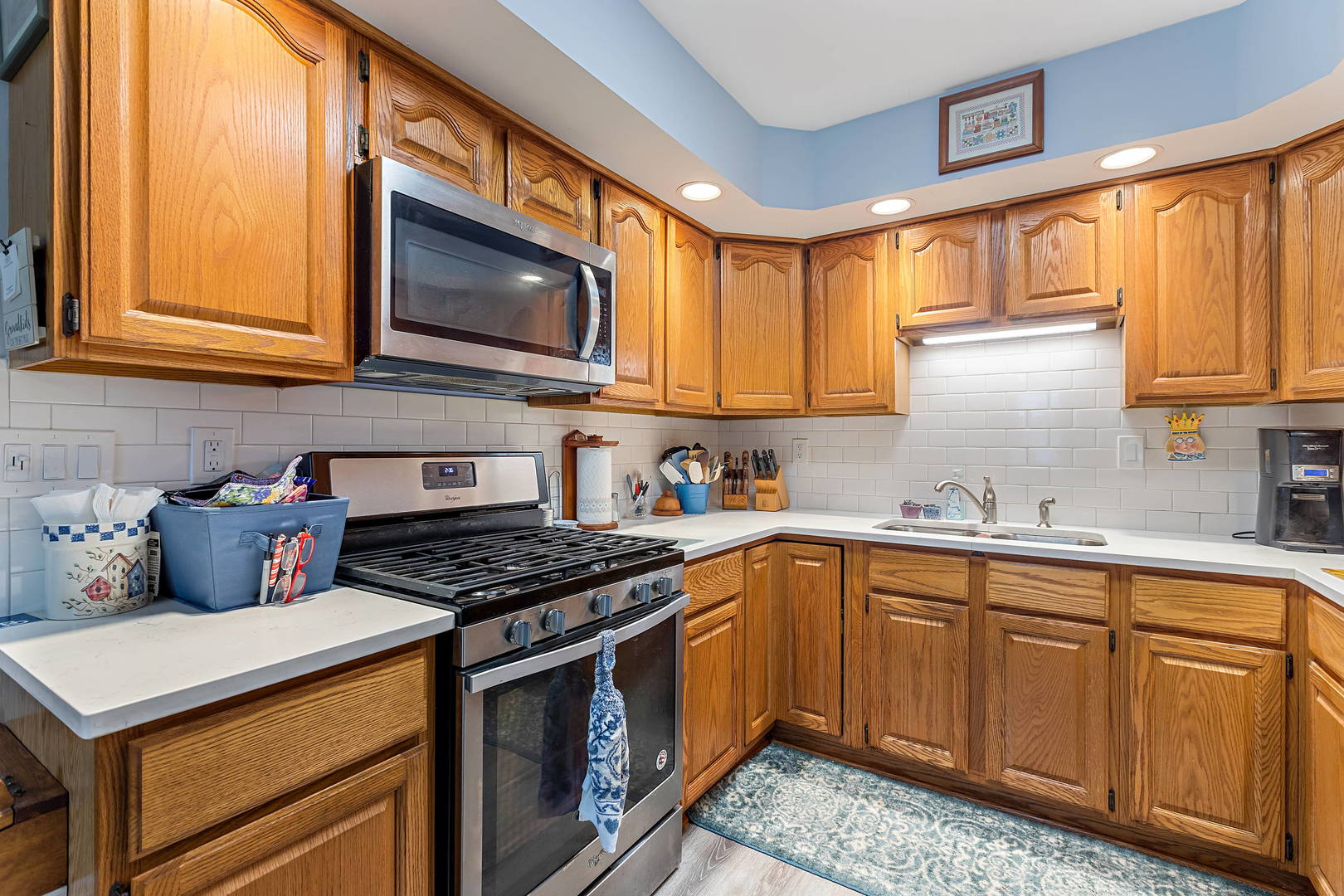 536 White Oak Road Bolingbrook, IL 60440 - Photo 10 of 16 a kitchen with stainless steel appliances granite countertop a stove a sink dishwasher and a microwave oven with cabinets