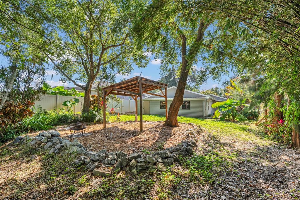 5357 Sunrise Boulevard Orlando, FL 32803 - Photo 23 of 26 a view of a house with a backyard