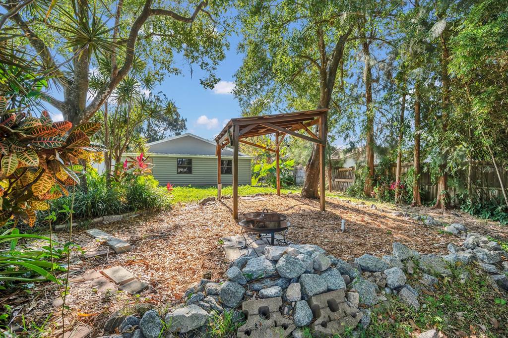 5357 Sunrise Boulevard Orlando, FL 32803 - Photo 24 of 26 a view of a house with backyard and a tree