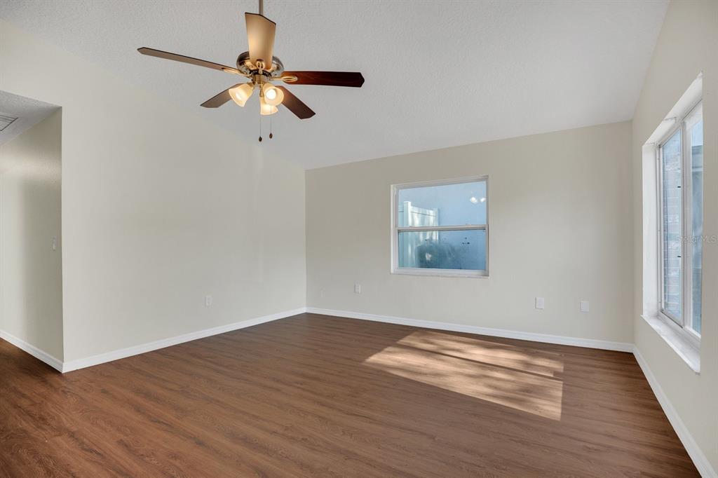 5357 Sunrise Boulevard Orlando, FL 32803 - Photo 8 of 26 a view of room with window and wooden floor