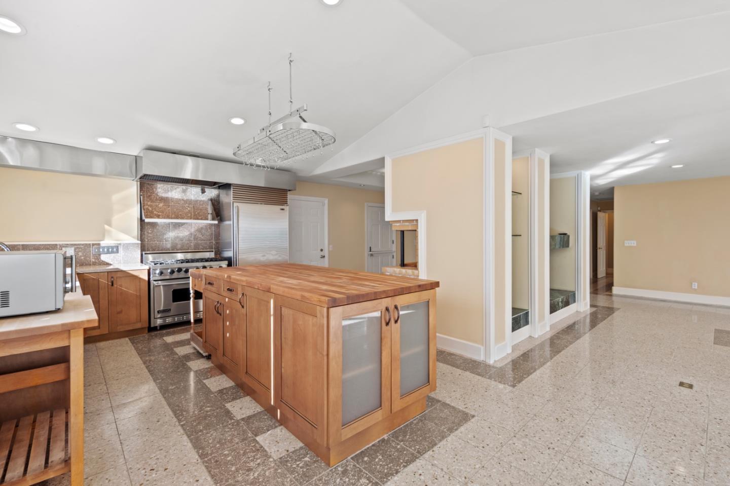 2903 Colton Road Pebble Beach, CA 93953 - Photo 12 of 32 a kitchen with stainless steel appliances granite countertop a stove and a refrigerator
