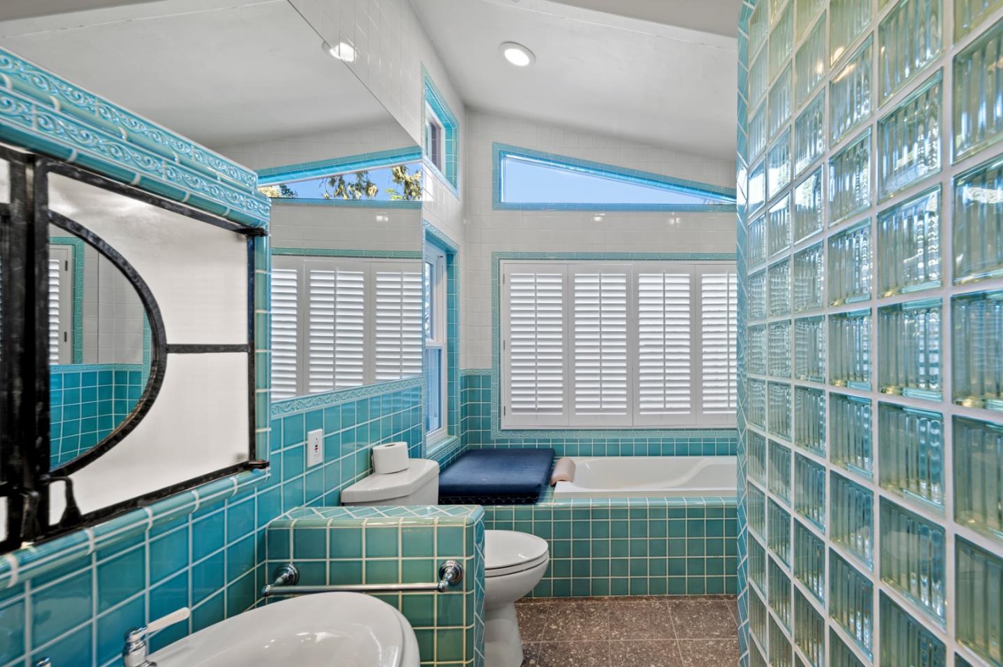 2903 Colton Road Pebble Beach, CA 93953 - Photo 20 of 32 a bathroom with a toilet a sink and a mirror