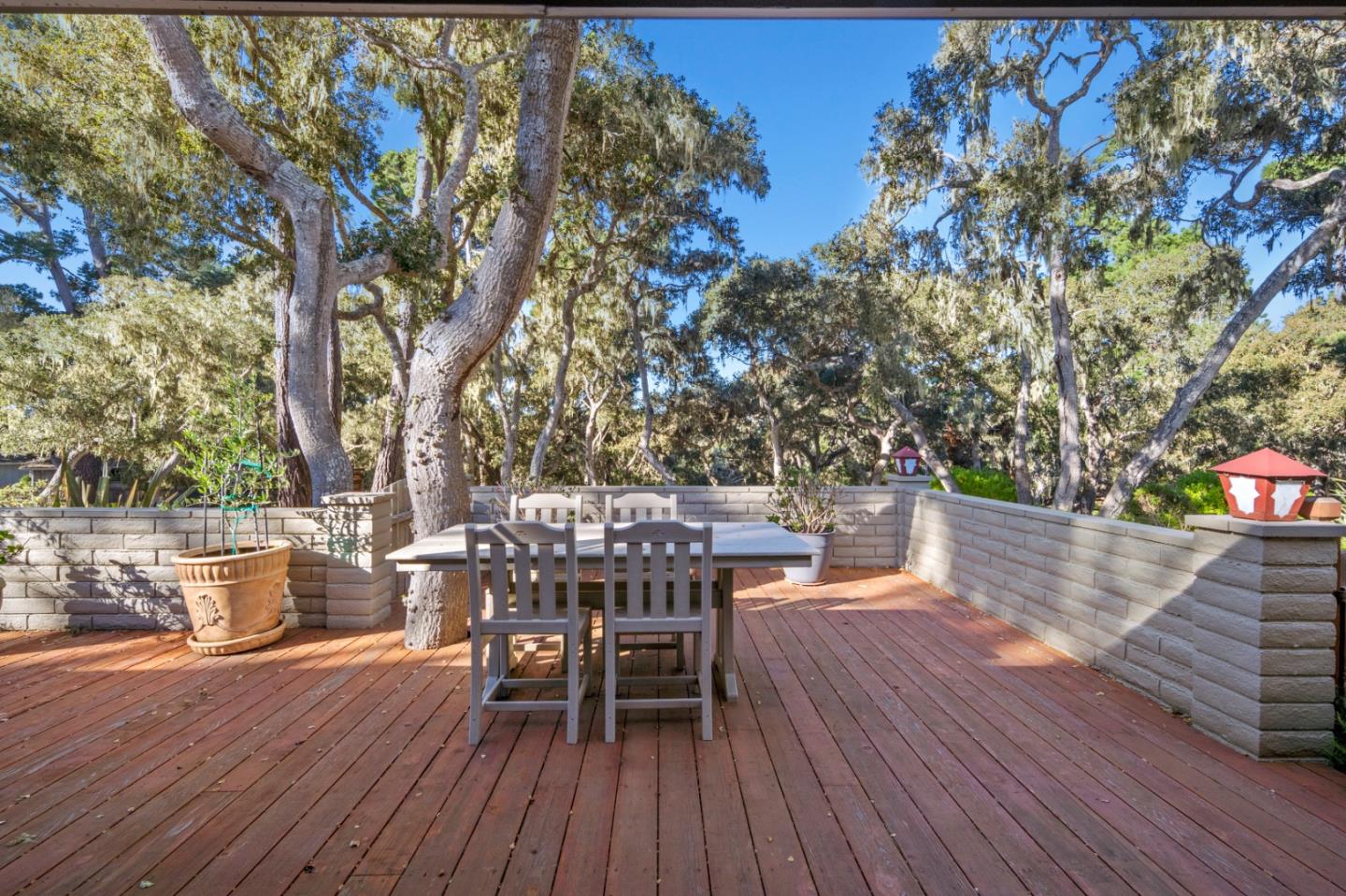 2903 Colton Road Pebble Beach, CA 93953 - Photo 27 of 32 a view of a chairs and table on the wooden deck