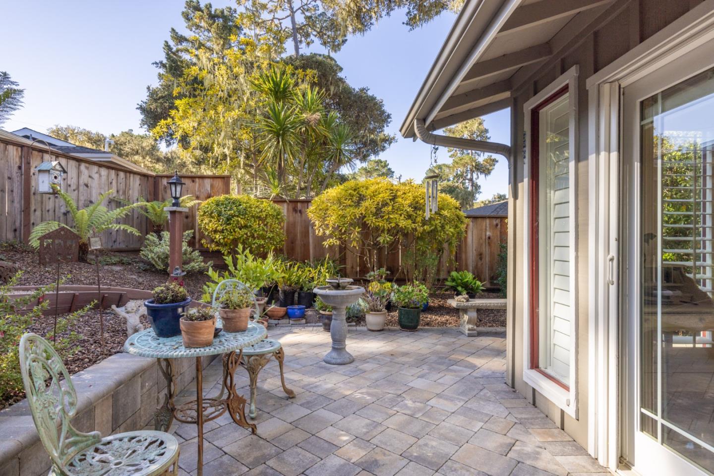 2903 Colton Road Pebble Beach, CA 93953 - Photo 31 of 32 a view of a patio with couches and potted plants