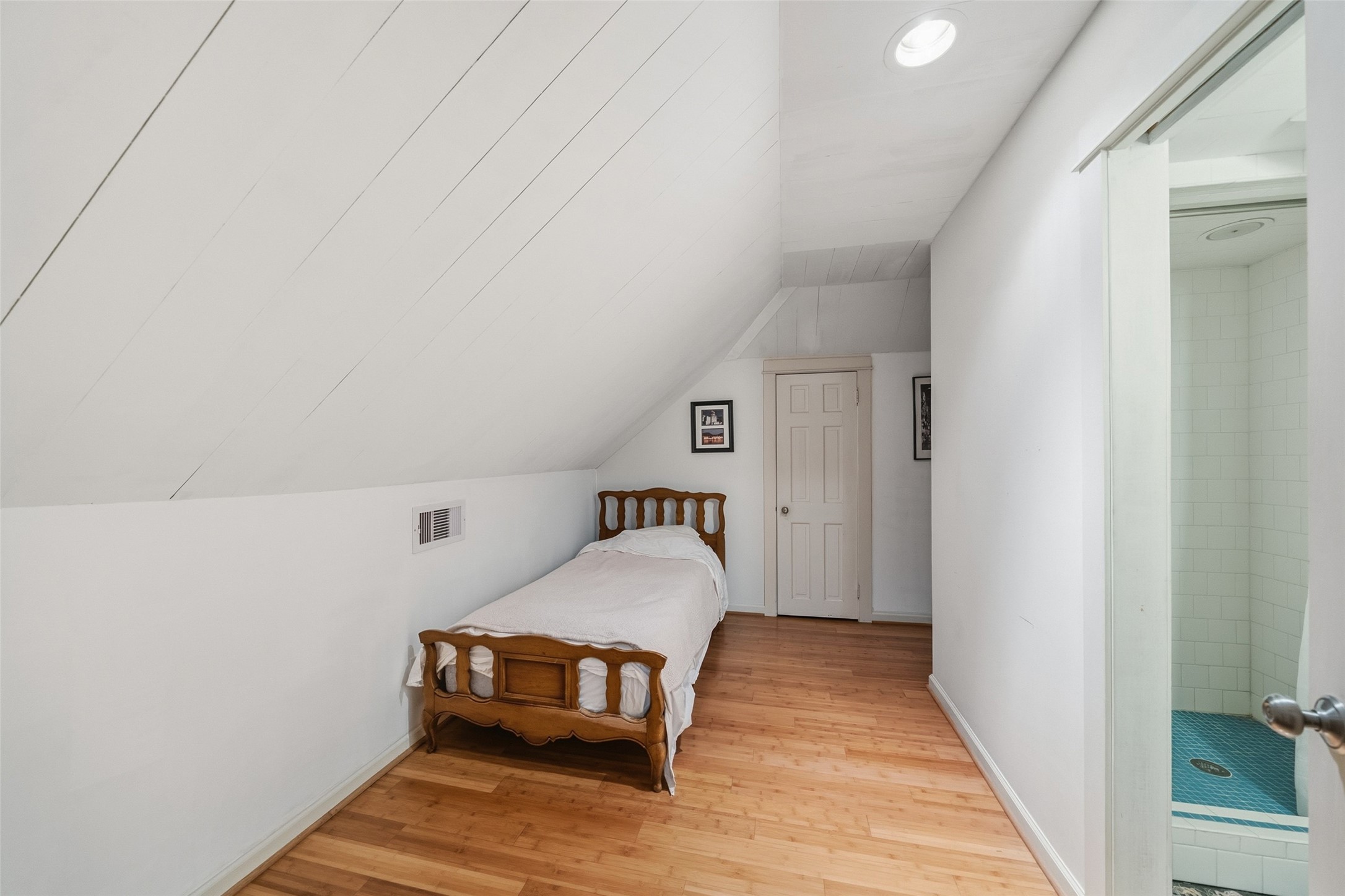 695 Wightman Street Matagorda, TX 77457 - Photo 14 of 40 a bedroom with a bed and a table