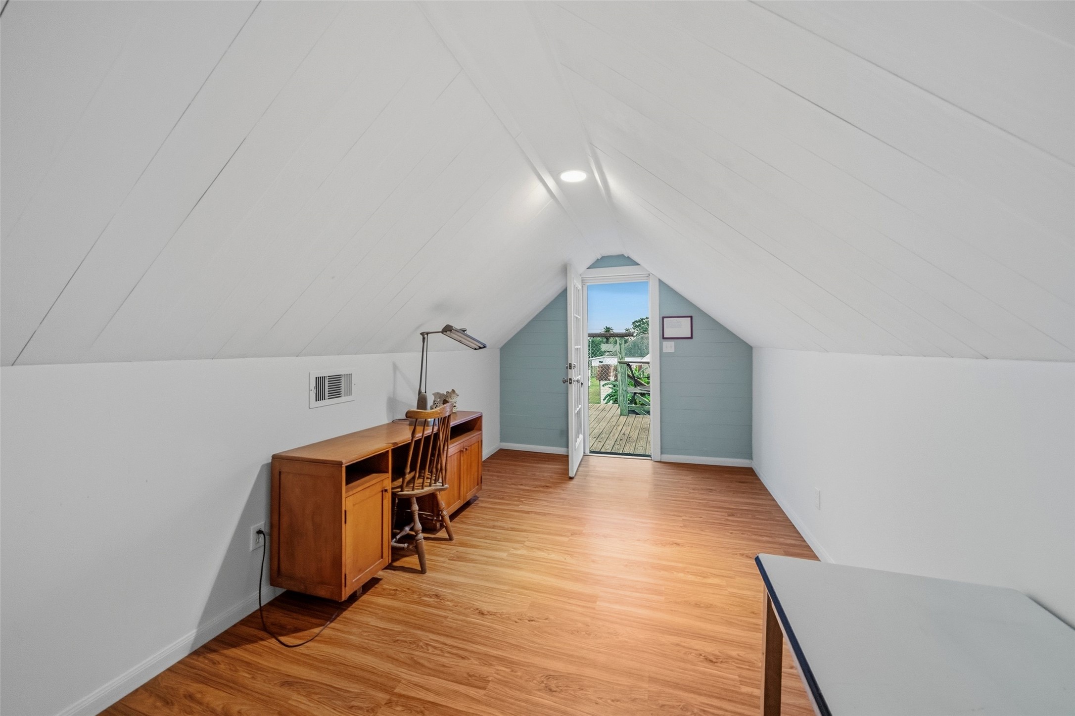 695 Wightman Street Matagorda, TX 77457 - Photo 16 of 40 a view of a livingroom with wooden floor and stairs