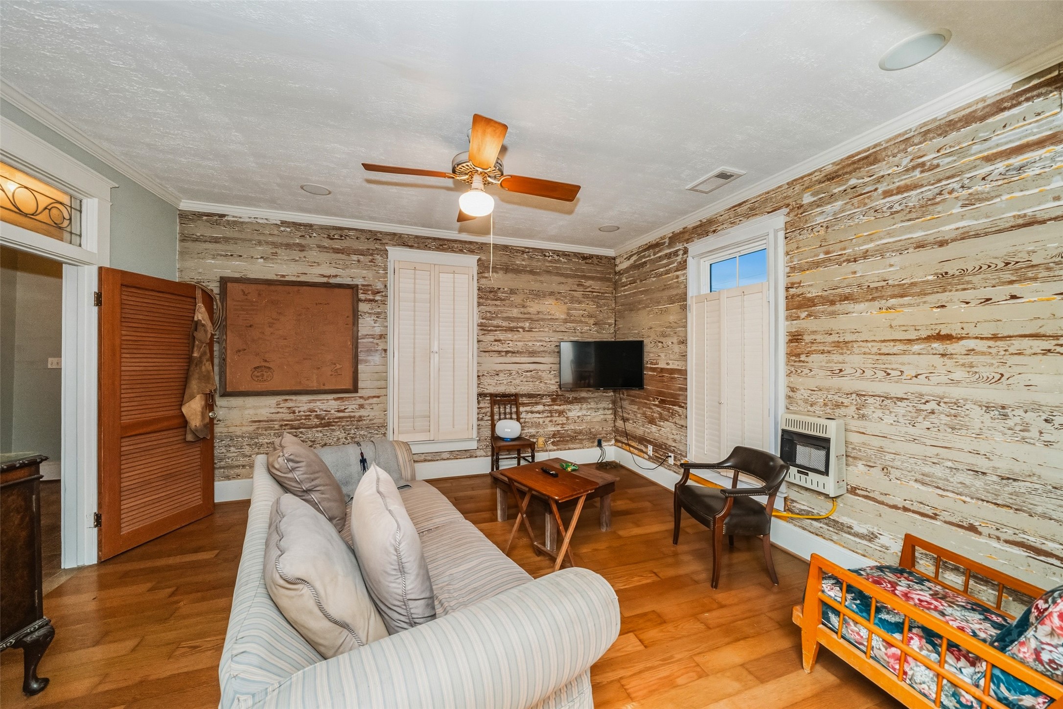 695 Wightman Street Matagorda, TX 77457 - Photo 21 of 40 a living room with furniture and a flat screen tv