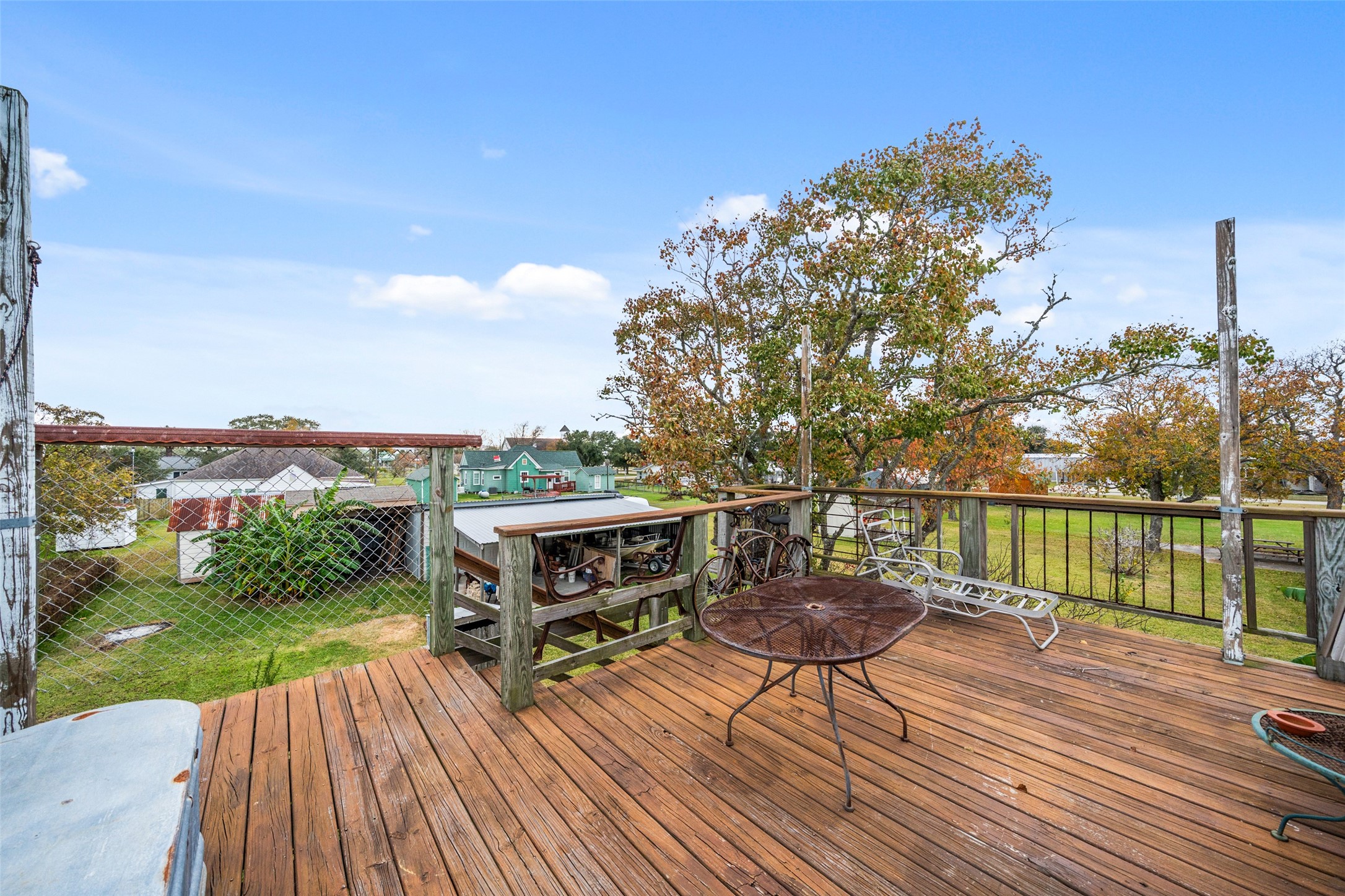 695 Wightman Street Matagorda, TX 77457 - Photo 10 of 40 a view of a chair and table on the wooden deck