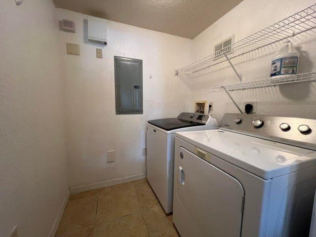 132 Southwest Peacock Boulevard, Unit 17104 Port St. Lucie, FL 34986 - Photo 17 of 28 a utility room with dryer and washer